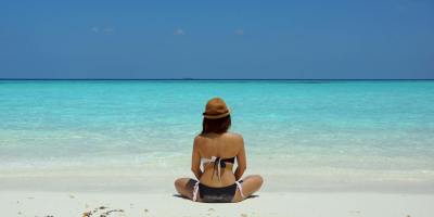 Woman sitting on a beach